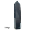 Close-up of a collection of Black Tourmaline crystal showing natural striations and deep black luster on a white background front view (356g)