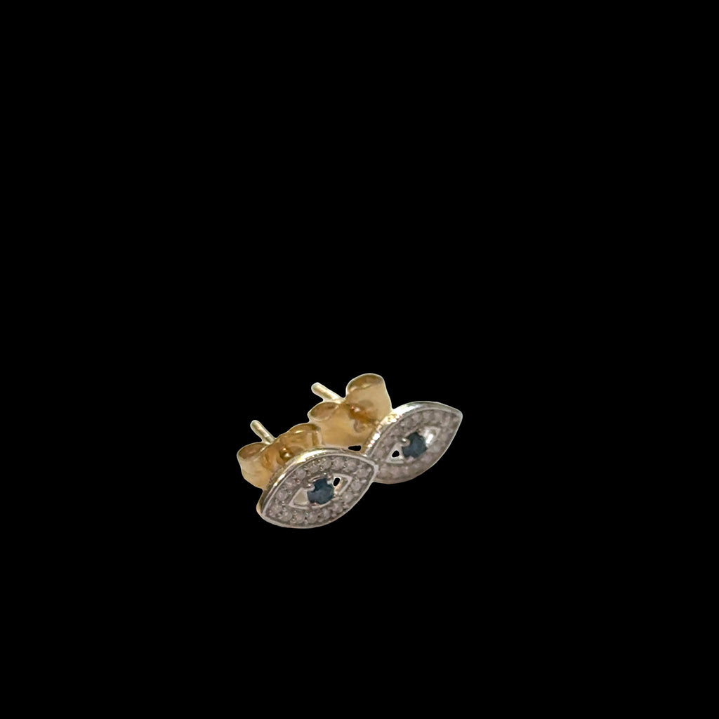 Close-up of gold evil eye studs with diamond accents, secure post backs, ancient talisman earrings, luxury protection jewelry, on a black background, front left angle view.