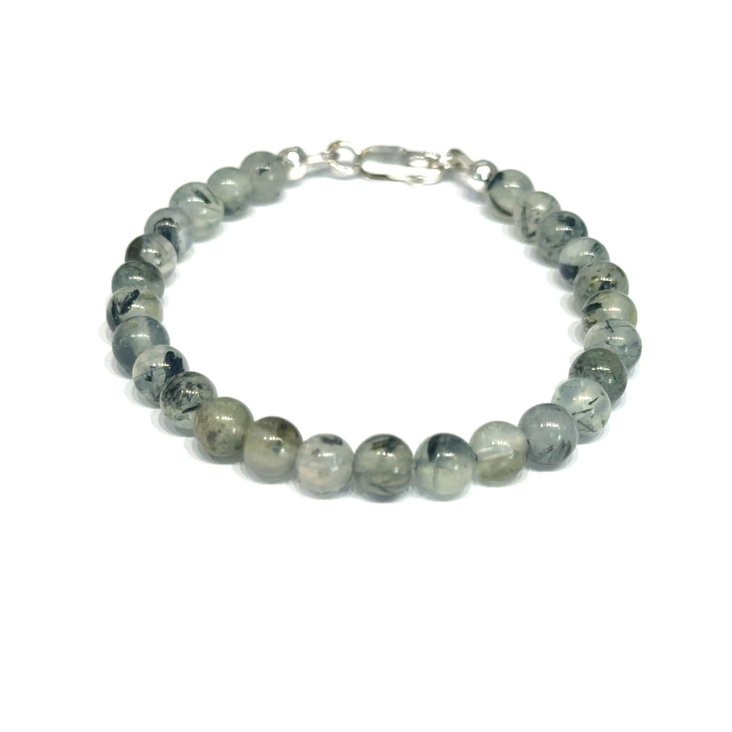 Close-up of natural prehnite beads displaying a soft green color and a smooth, polished finish, size 6.5, on a white background, front view. 