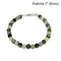 Close-up of natural prehnite beads displaying a soft green color and a smooth, polished finish, size 7, on a white background, front overview. 