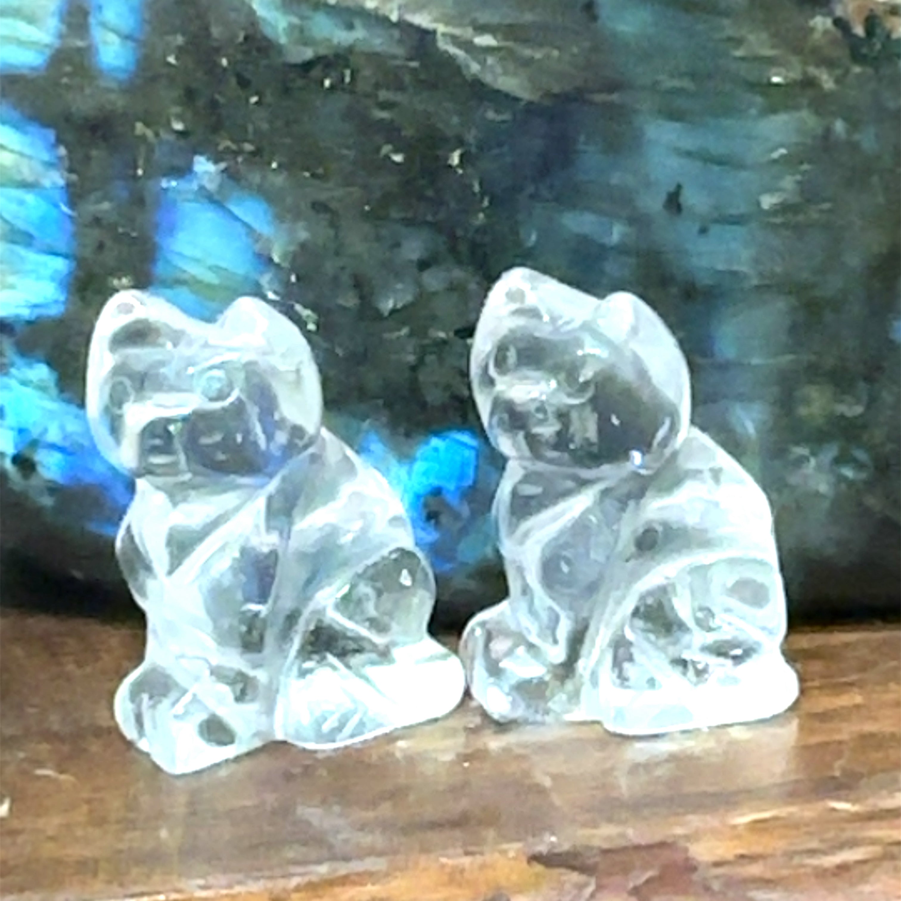 Close-up of polished gemstone cat  grouping of Clear Quartz showing crystal texture and color variation. On brown background front overview