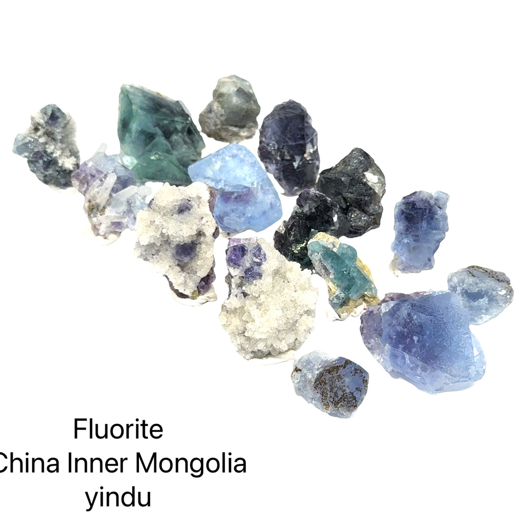 Collection of fluorite crystals from China, Inner Mongolia, with text indicating origin,  front view.