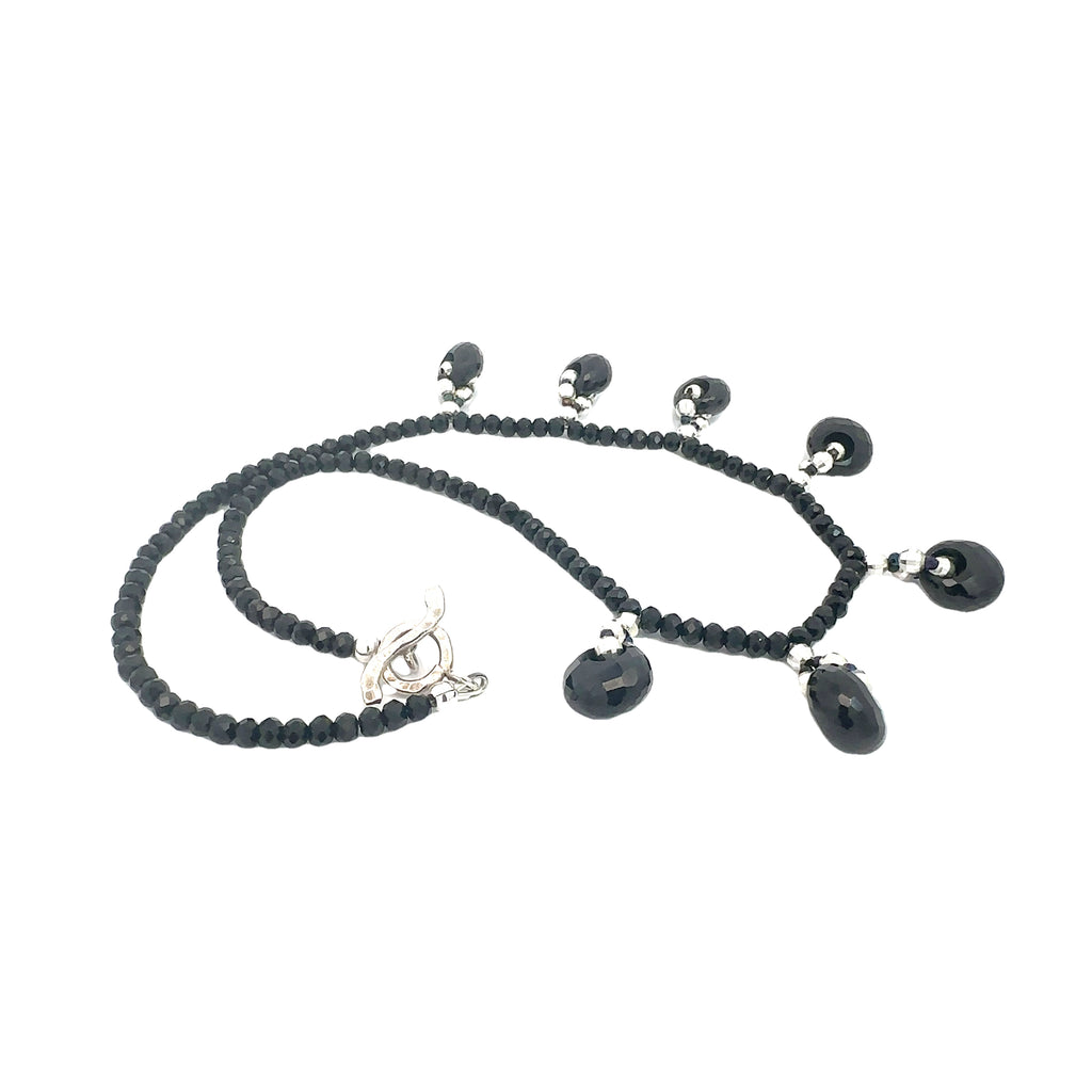 Crystal healing necklace with Black Tourmaline and Black Spinel beads for positivity and aura protection on the white side overview