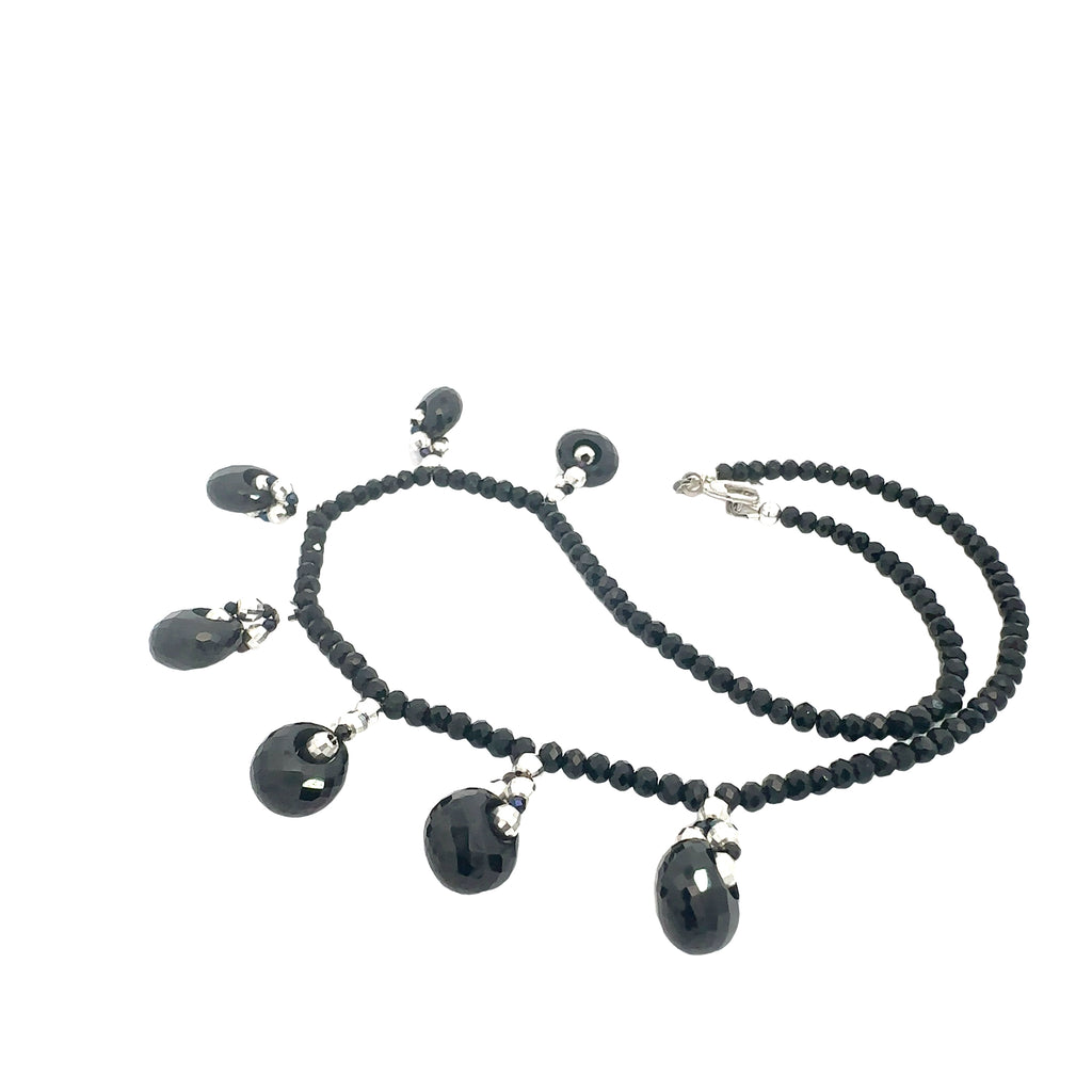 Crystal healing necklace with Black Tourmaline and Black Spinel beads for positivity and aura protection on white side overview