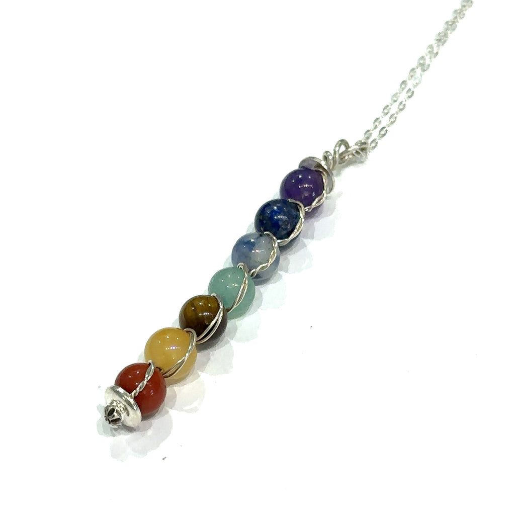 Custom chakra gemstone necklace for energy alignment and healing on white long center overview 