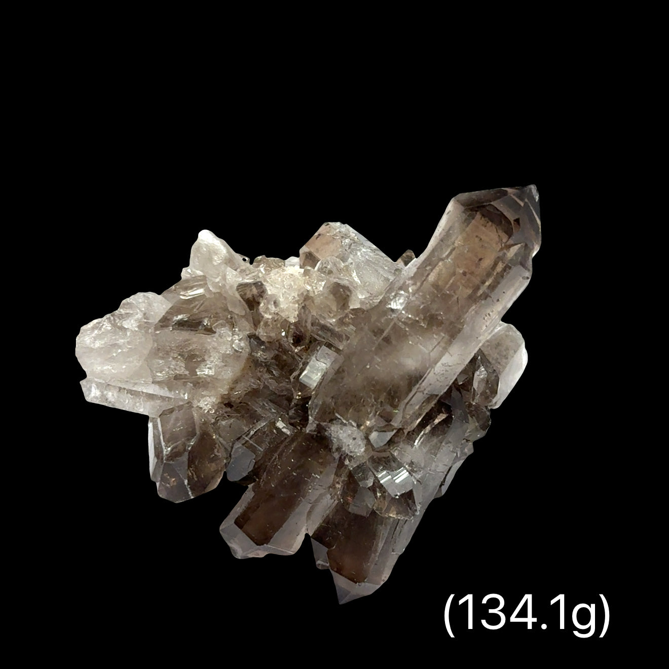 Deep smoky gray Quartz cluster with crystalline structure for electromagnetic protection weighs (134.1g), on a black background, front view.
