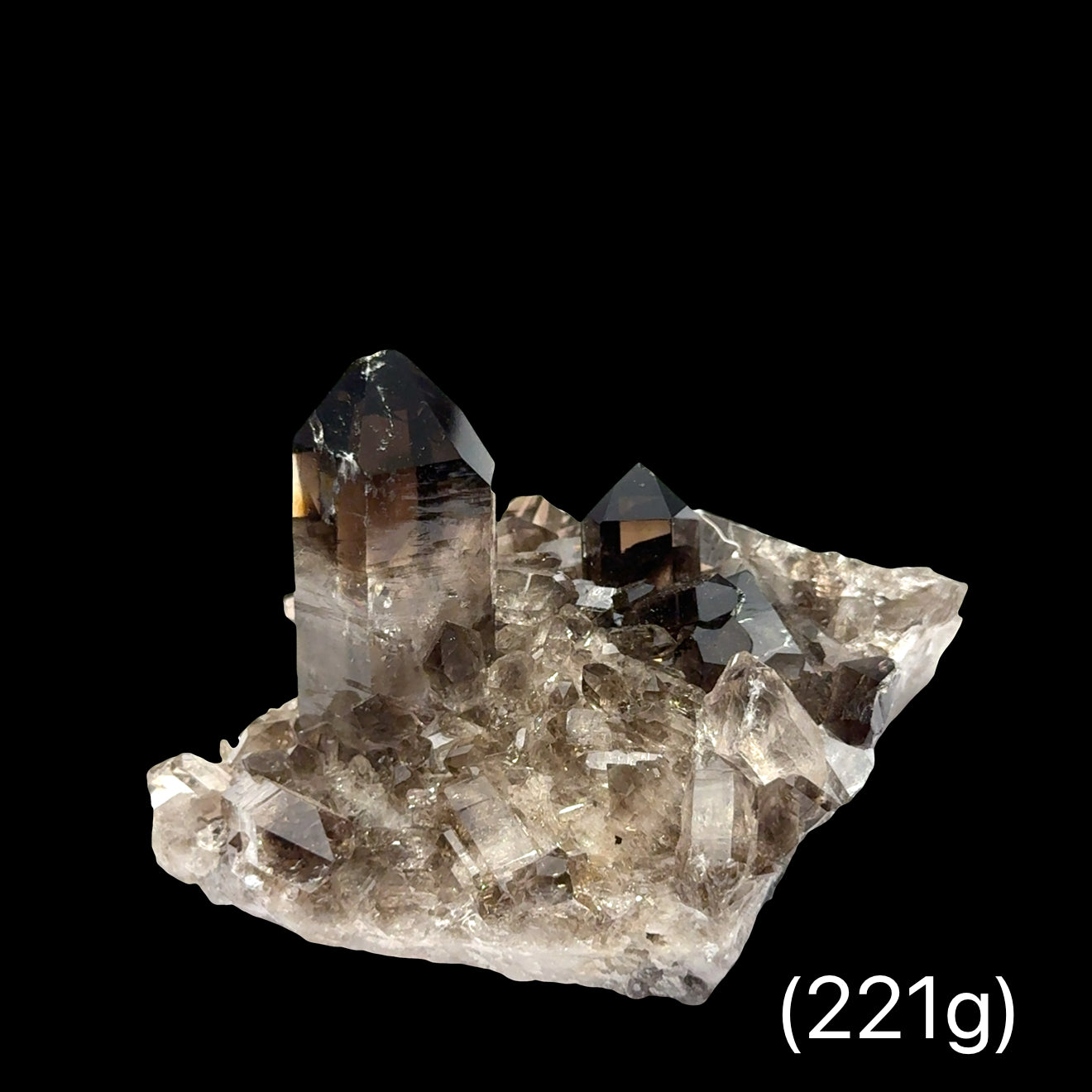 Deep smoky gray Quartz cluster with crystalline structure for electromagnetic protection weighs (221g), on a black background, front view.
