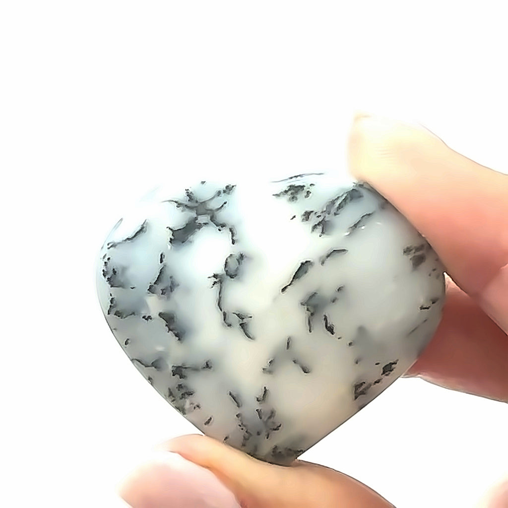 Dendritic Opal Gemstone Heart in hand on white front view