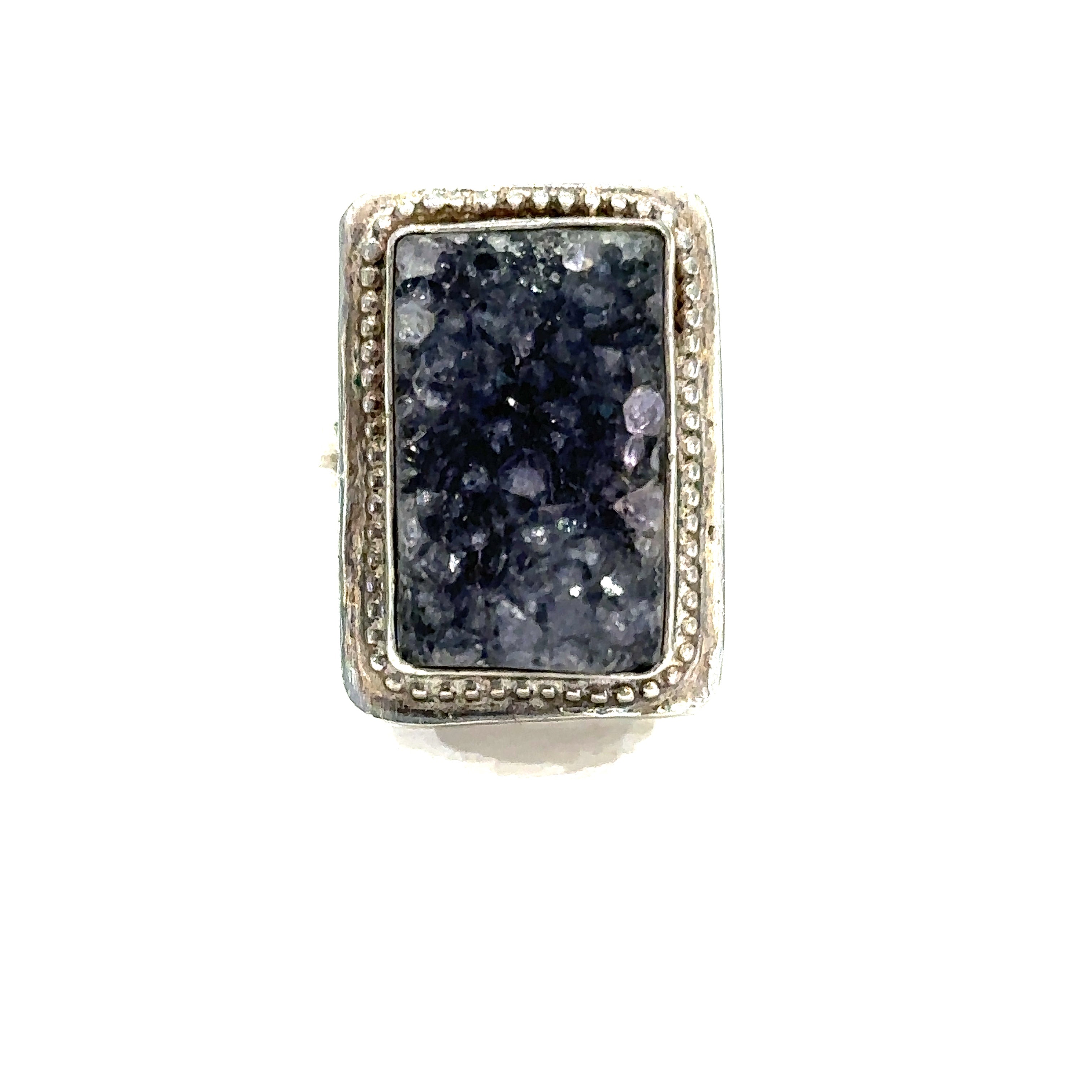 Detailed close-up of natural Amethyst druzy crystal showing purple sparkle and raw texture on white front center view