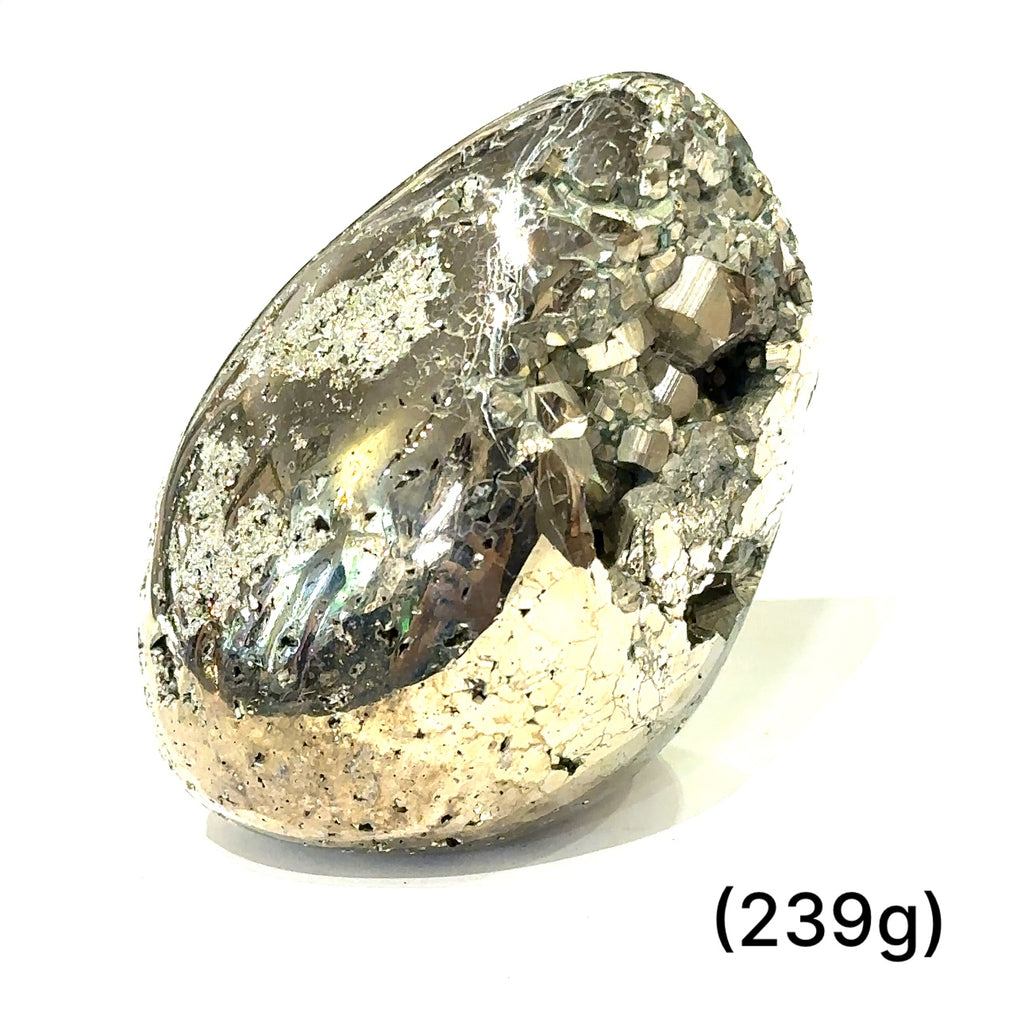 Detailed close-up of natural Pyrite crystal surface highlighting metallic shimmer and unique formation patterns on white (239g) front up close view