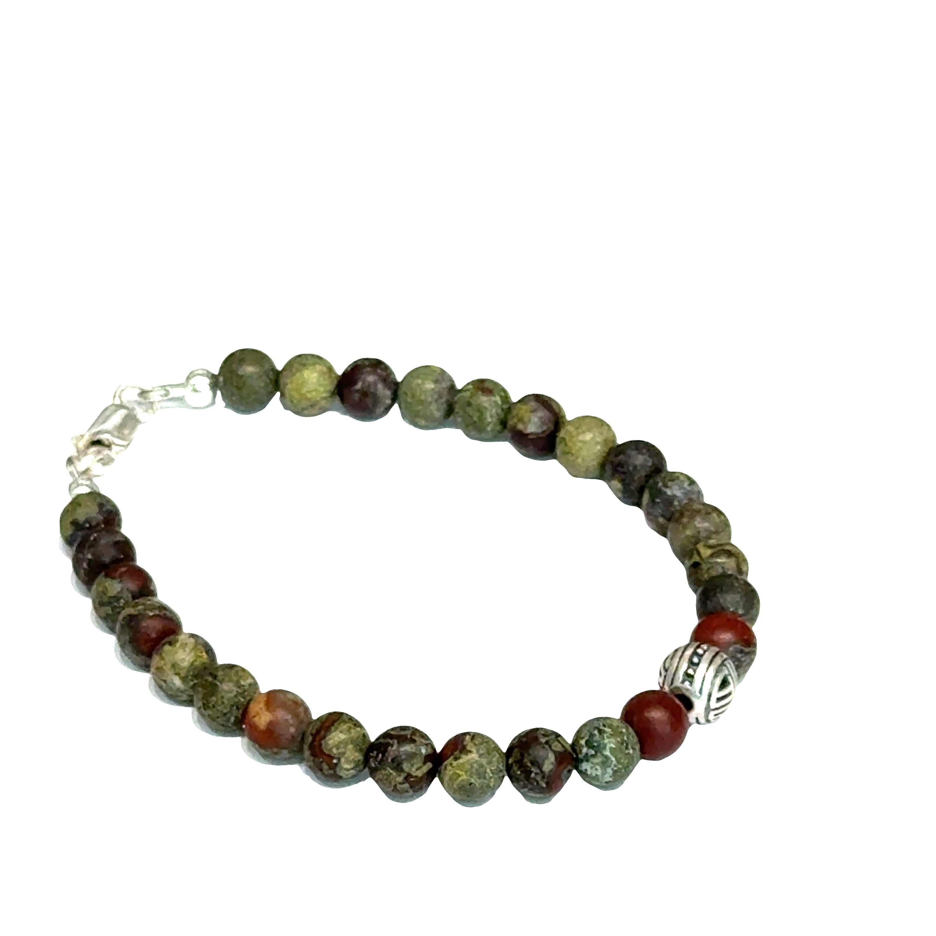Dragon Blood Jasper gemstone beaded bracelet with sterling silver pattern bead and a lobster claw clasp showing red and green natural patterns  on a white background, right angle view. 