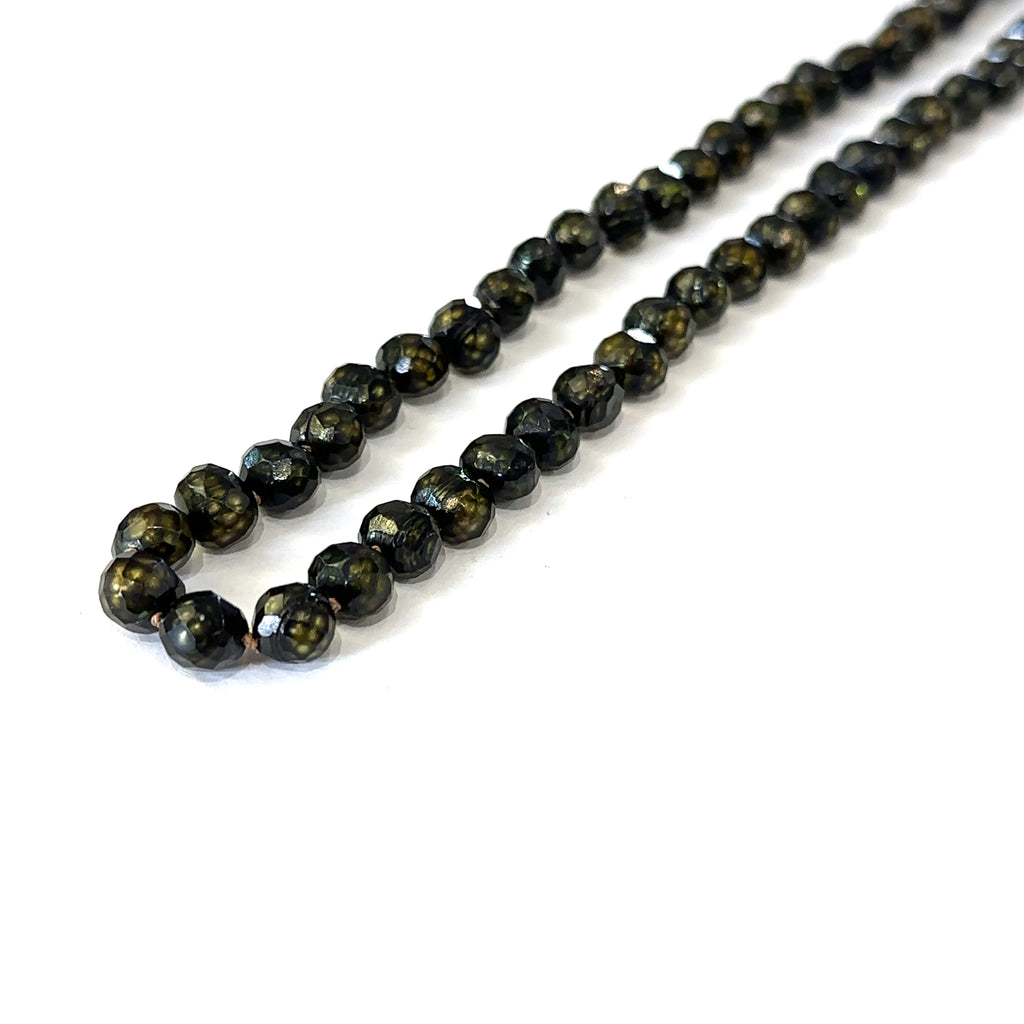 Elegant 18 inch black pearl necklace handmade in Boston, Massachusetts on white long angled view