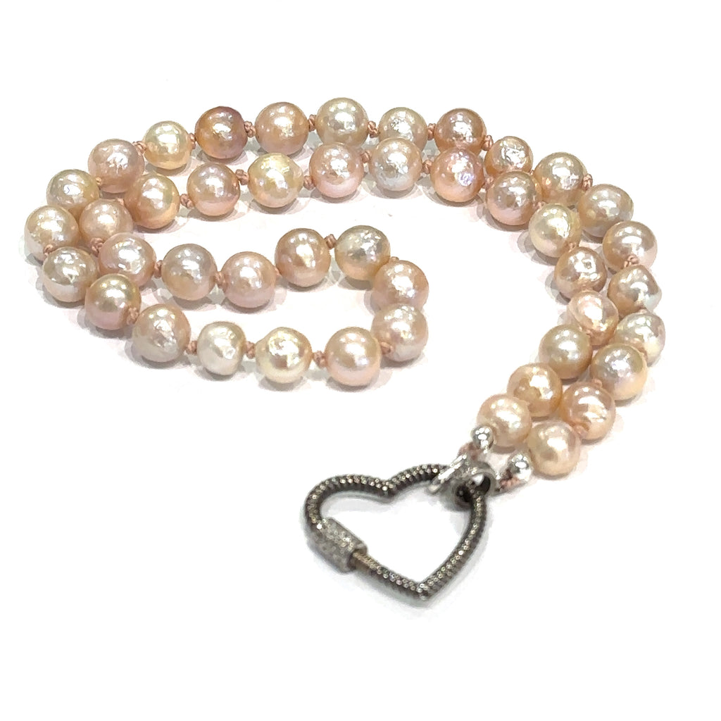Elegant 19 inch Akoya pearl strand necklace silk‑knotted for durability on white center overview