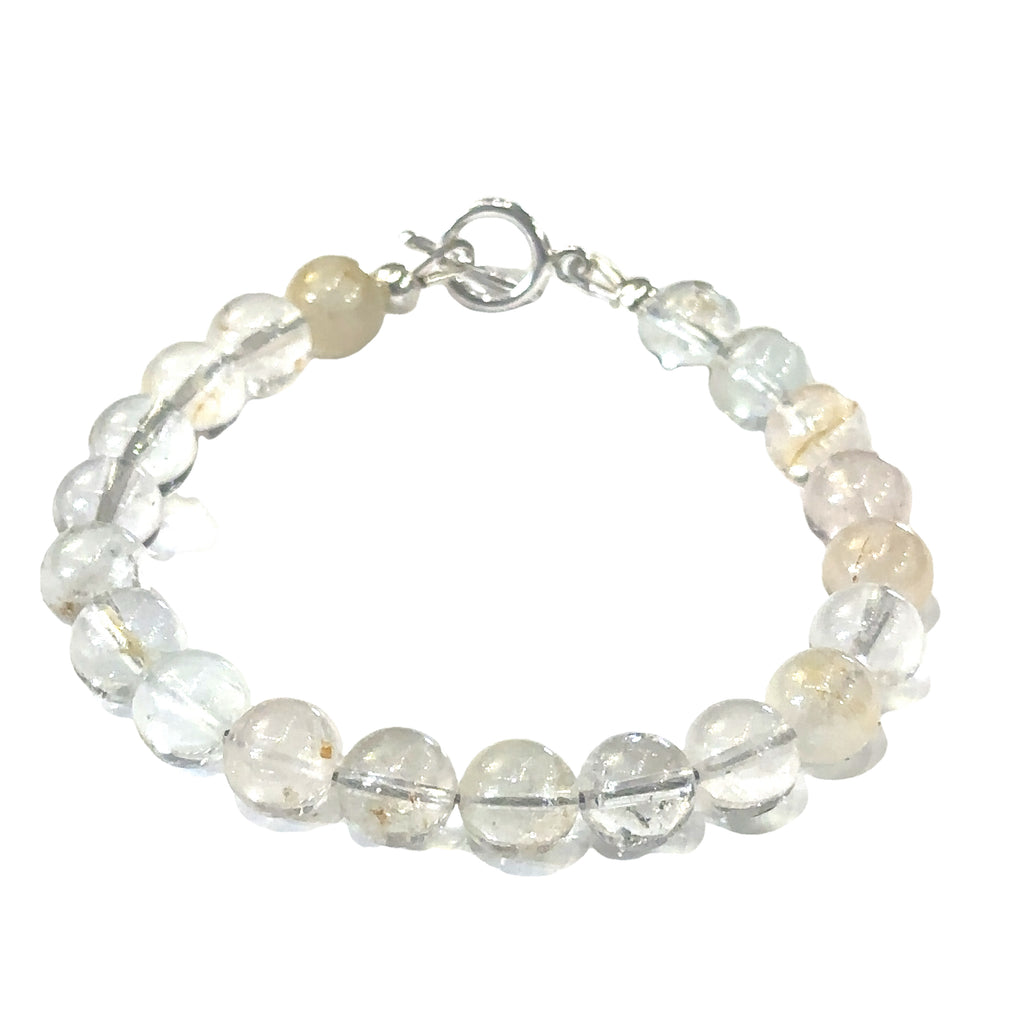 Elegant Blue Topaz crystal bracelet for knowledge, communication, and strength on white front overview