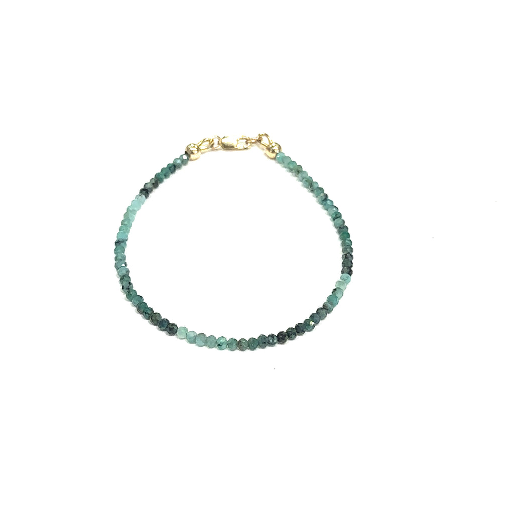 Elegant Emerald crystal bracelet for love, compassion, and emotional healing on white center overview
