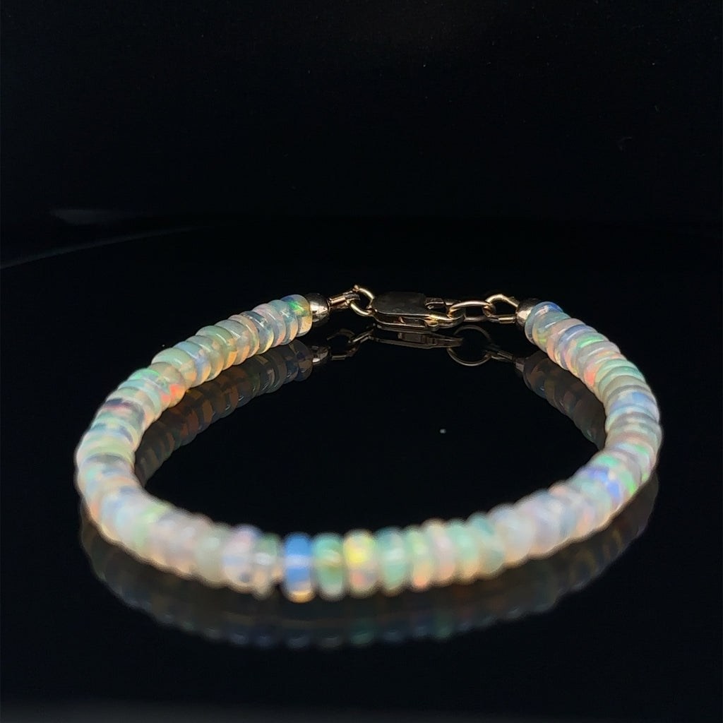 Elegant Ethiopian Opal crystal bracelet available in 6.5'' and 7'' sizes on black front view