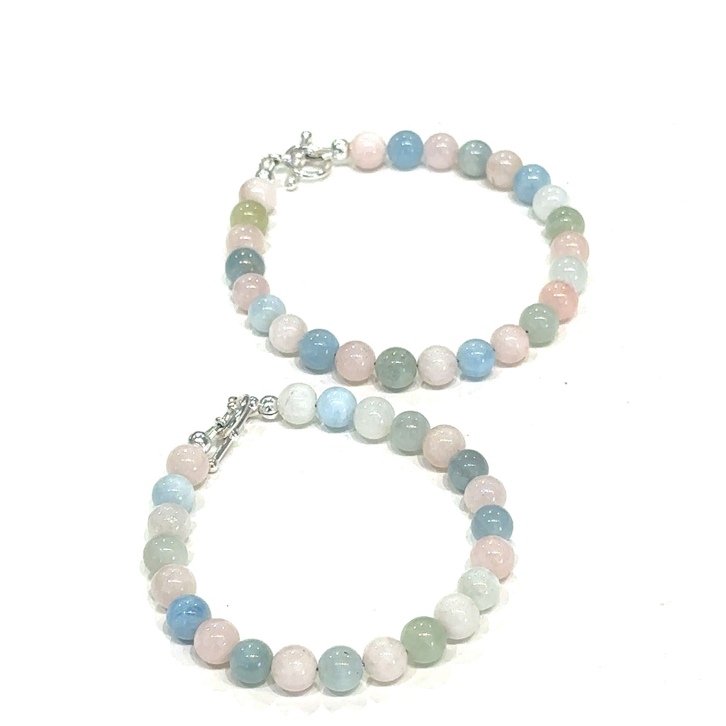 Elegant Morganite crystal bracelet available in sizes 6.25"–7.25" grouping on white center overview