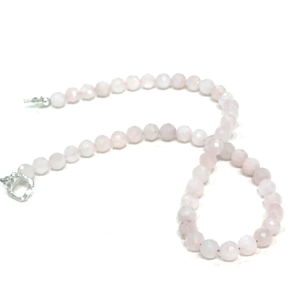 Elegant Rose Quartz crystal necklace for love, compassion, and emotional healing on white angle center view