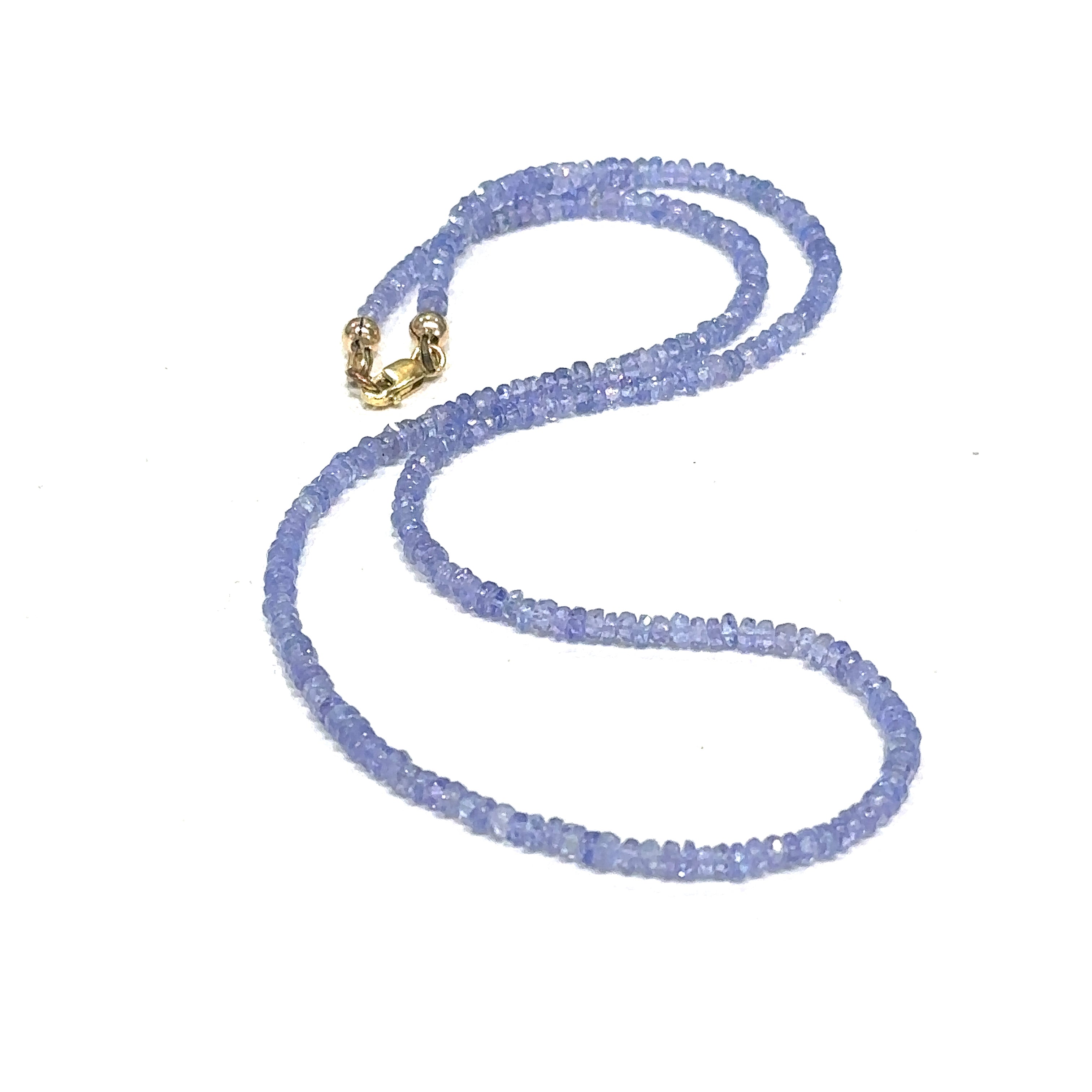  Elegant Tanzanite crystal necklace for intuition, meditation, and spiritual awakening on a white center long overview
