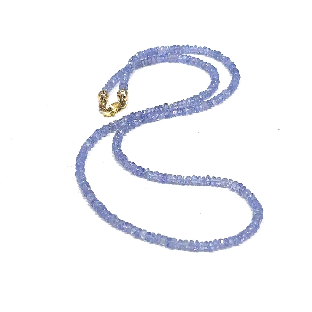  Elegant Tanzanite crystal necklace for intuition, meditation, and spiritual awakening on a white center long overview