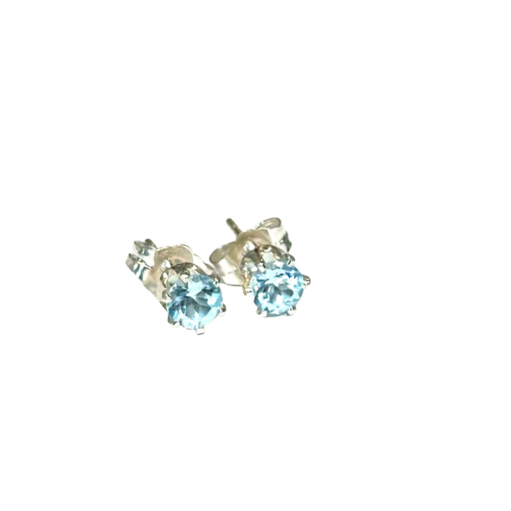 Elegant handmade Blue Topaz earrings for November birthstone gift on white background front overview.