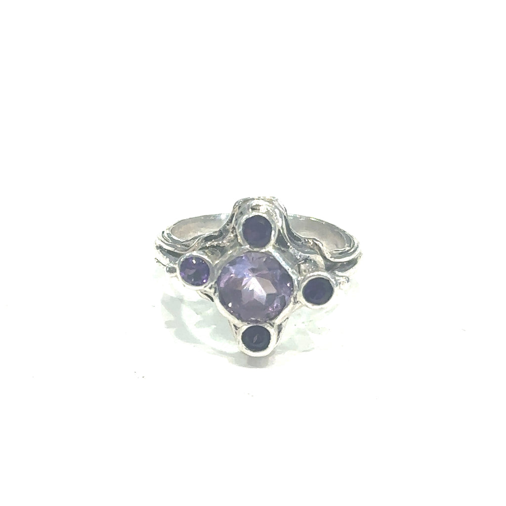 Elegant sterling silver ring with Amethyst gemstones for spiritual healing and balance on white center view