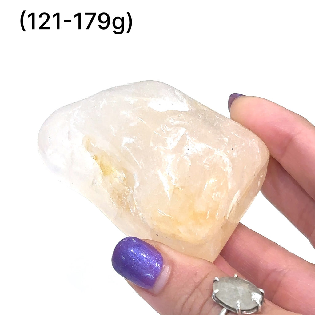 Ethically sourced Golden Healer Quartz tumbled gemstone with radiant golden hues (121-1179g) on white overview
