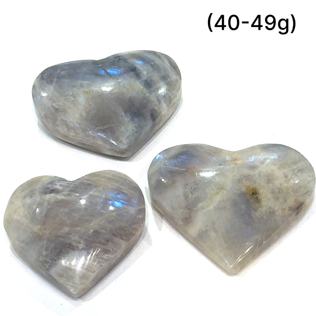 Ethically sourced Grey Moonstone crystal heart with free information card grouping of (40-49g) front view