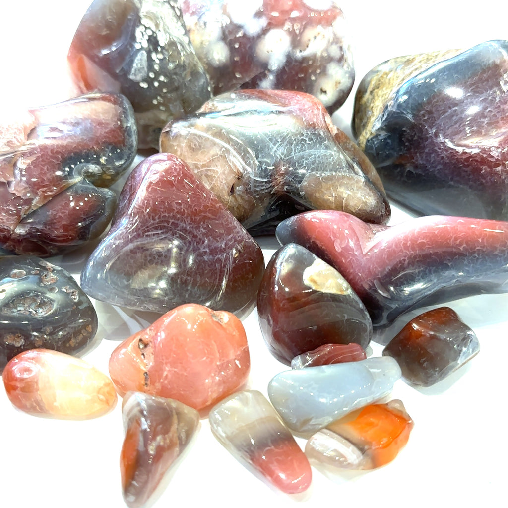 Ethically sourced Malawi Agate tumbled gemstone with natural earthy tones grouping of gemstone on white overview 