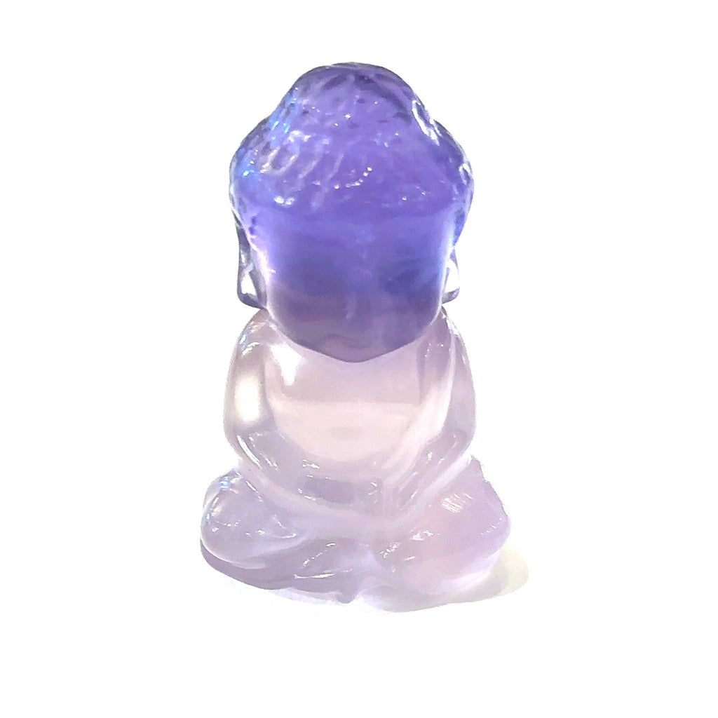 Ethically sourced fluorite gemstone Buddha carving with purple hues on white front view