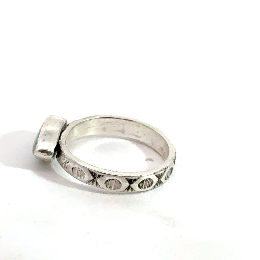 Evil‑Eye Mother‑of‑Pearl Ring on white, up close left side view