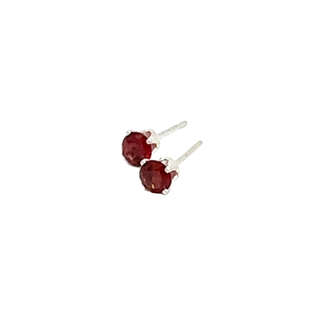 Faceted 4mm Garnet Post Earrings in Sterling Silver  Basket Setting 4 prong on white front left angled overview