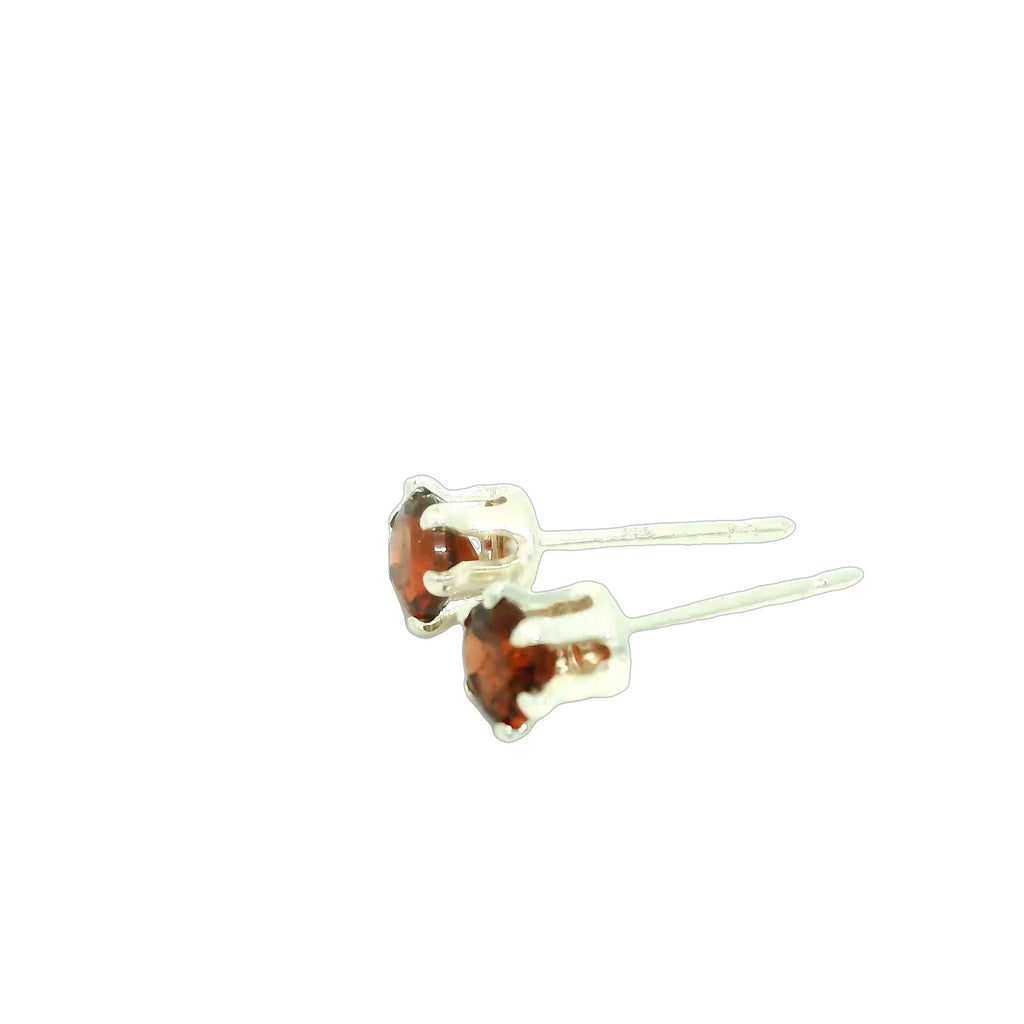 Faceted 4mm Garnet Post Earrings in Sterling Silver  Basket Setting six prong on white  left side  angle overview