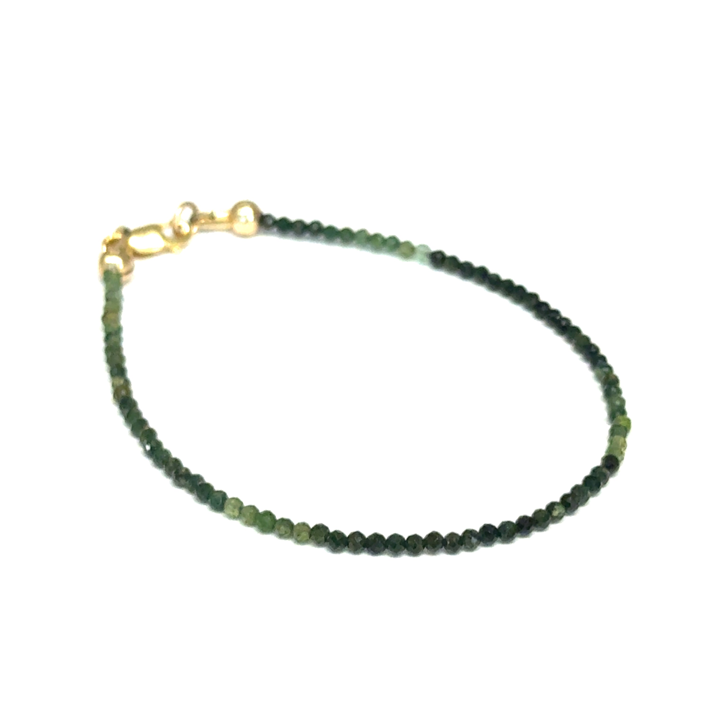 Faceted green tourmaline gemstone bracelet with gold-filled lobster claw clasp on white background, front right angle overview.