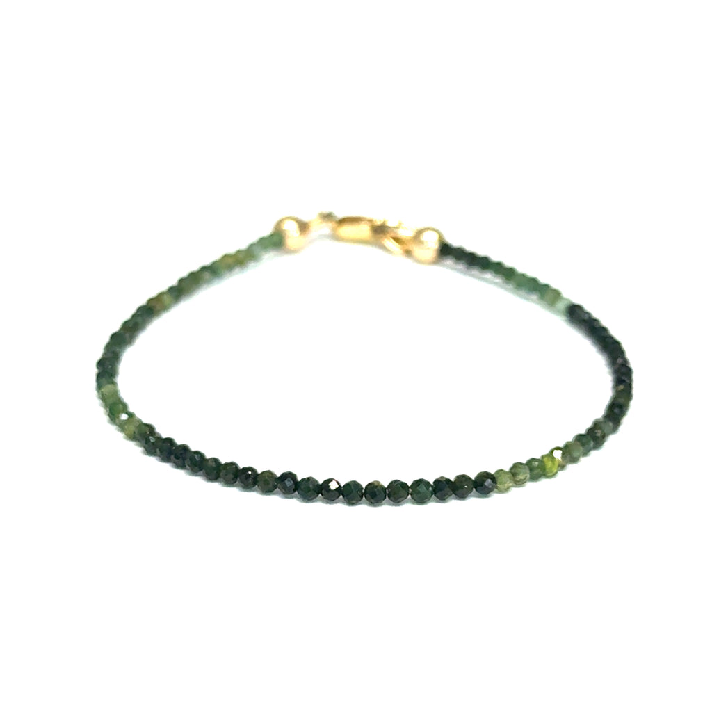 Faceted green tourmaline gemstone bracelet with gold-filled lobster claw clasp on white background, front view.