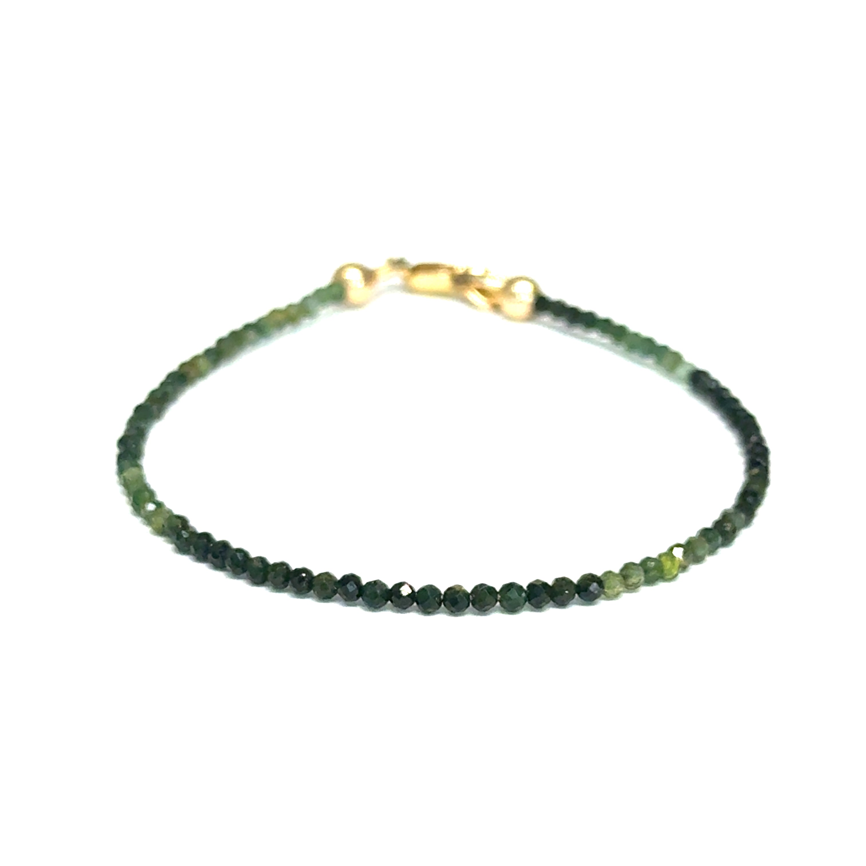 Faceted green tourmaline gemstone bracelet with gold-filled lobster claw clasp on white background, front view.
