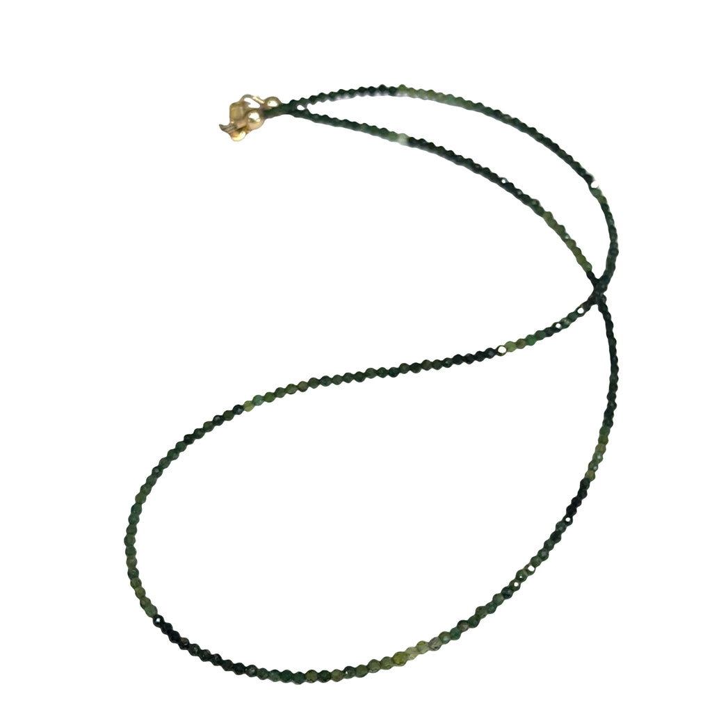 Faceted green tourmaline gemstone necklace with gold-filled lobster claw clasp on white background, front overview.