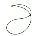 Faceted green tourmaline gemstone necklace with gold-filled lobster claw clasp on white background, front overview.