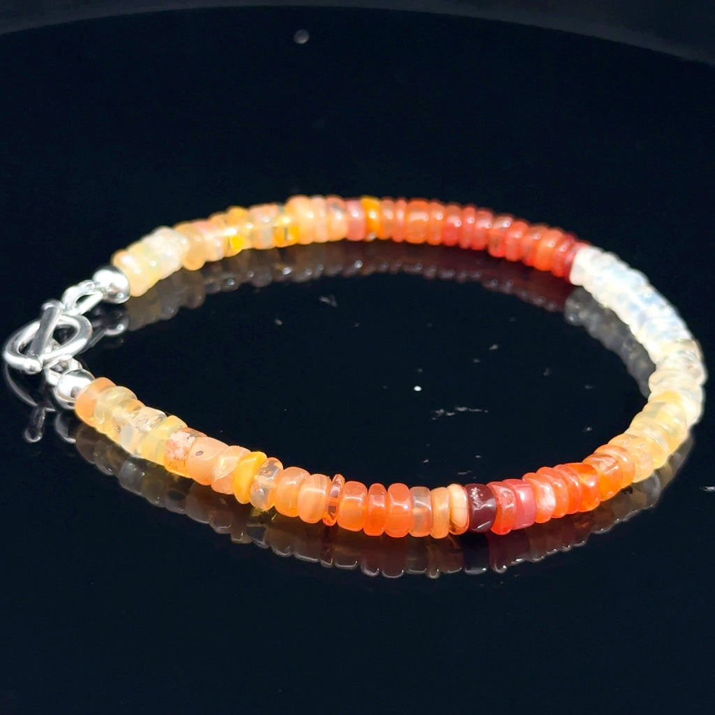 Fire Opal Gemstone bracelet  on black left side