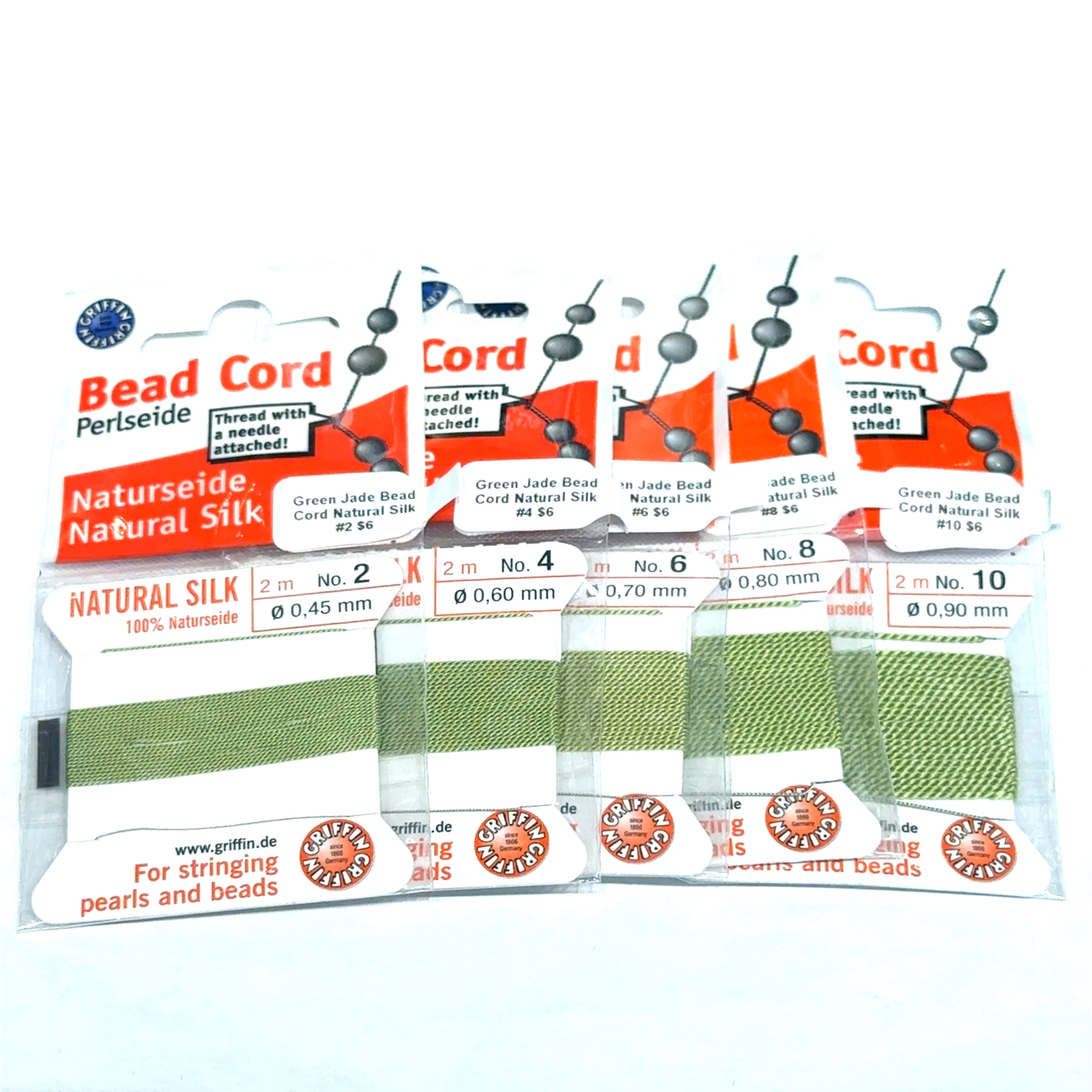 Five package of Green Jade  Natural Silk Bead Cord  #2,4, 6, 8, & 10 on a white background, front view.