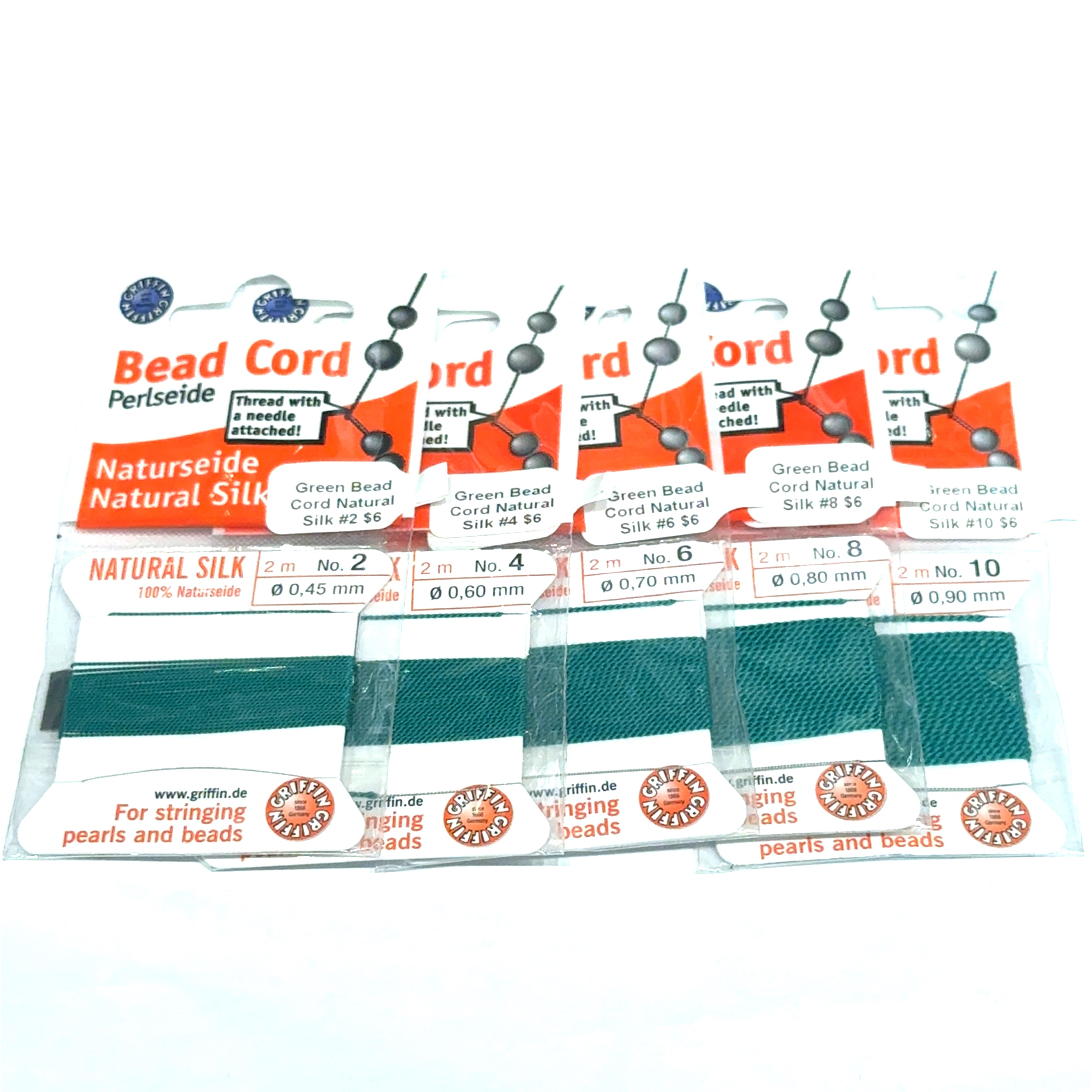 Five packages of Green Natural Silk Bead Cord  #2,4, 6, 8, & 10 on a white background, front view.