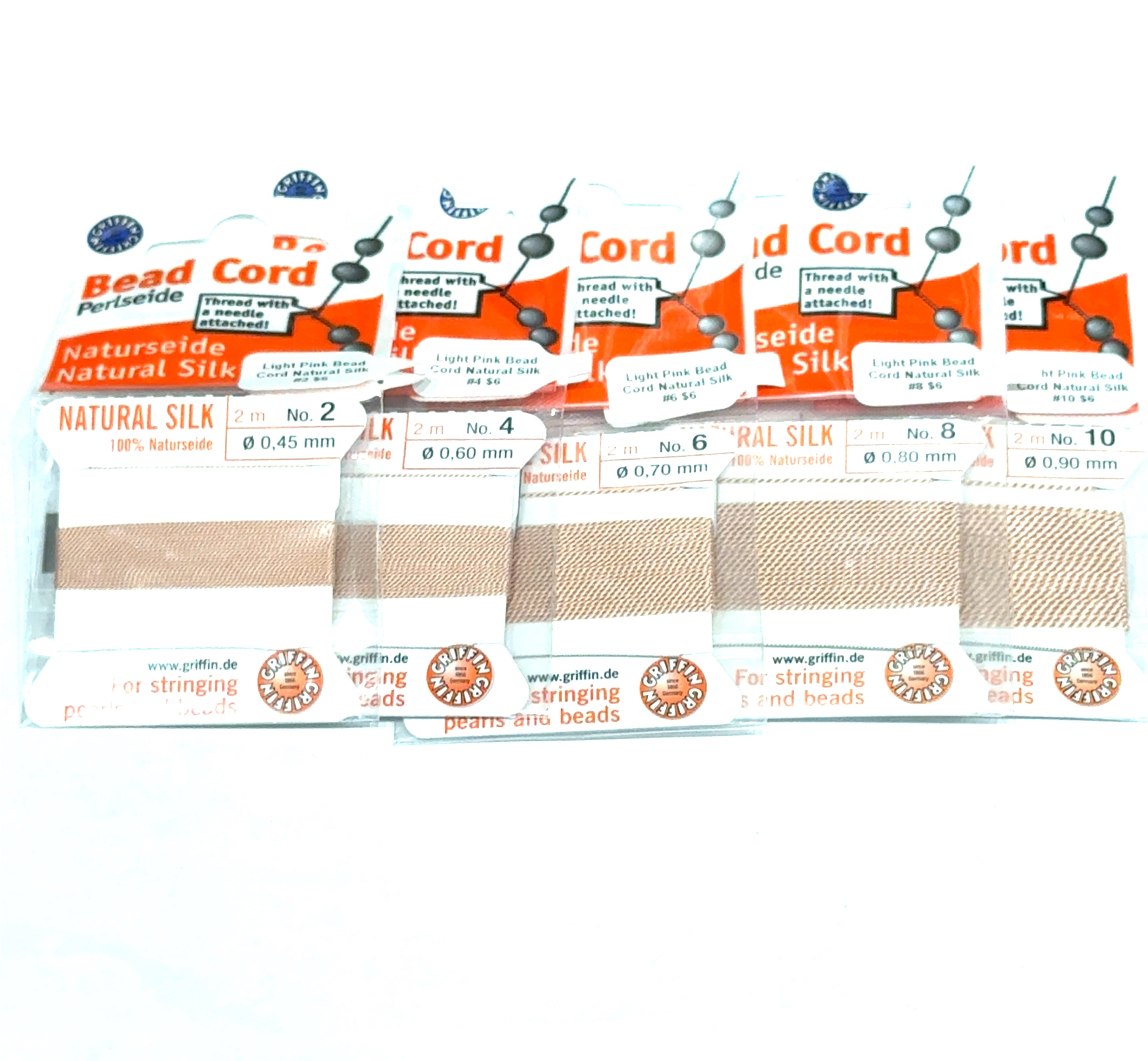 Five packages of Light Pink Natural Silk Bead Cord  #2, 4, 6, 8, & 10 on a white background, front view.