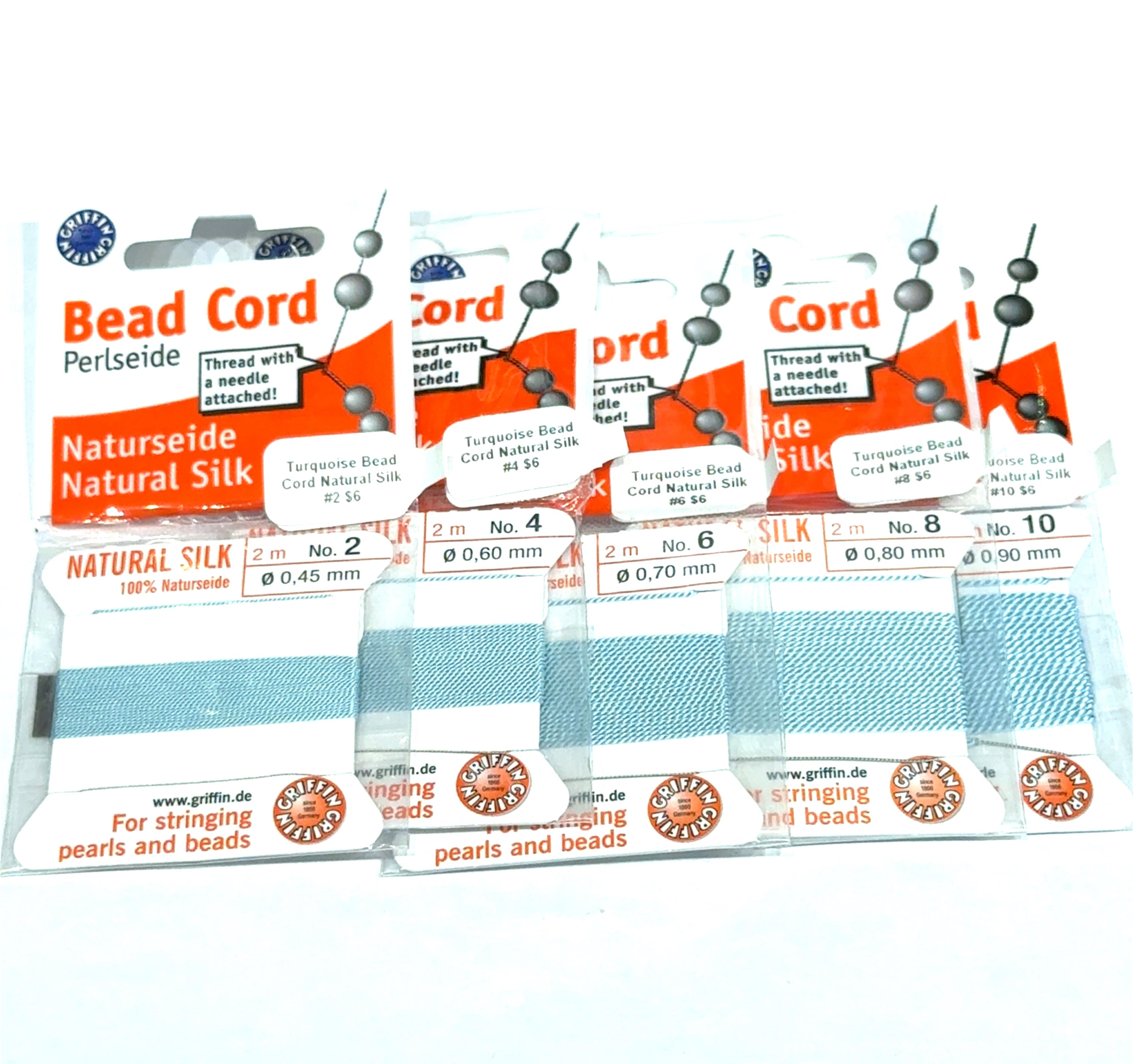 Five packages of Turquoise Natural Silk Bead Cord  #2,4, 6, 8, & 10 on a white background, front view.