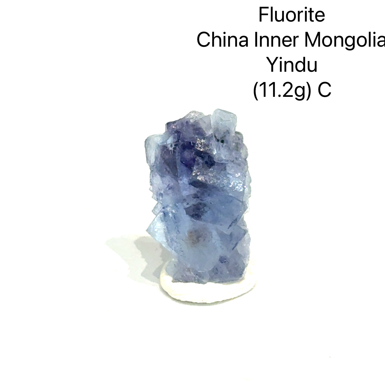 Fluorite crystal from China, Inner Mongolia, with weight and origin information on a white background, (11.2g) C front view. 