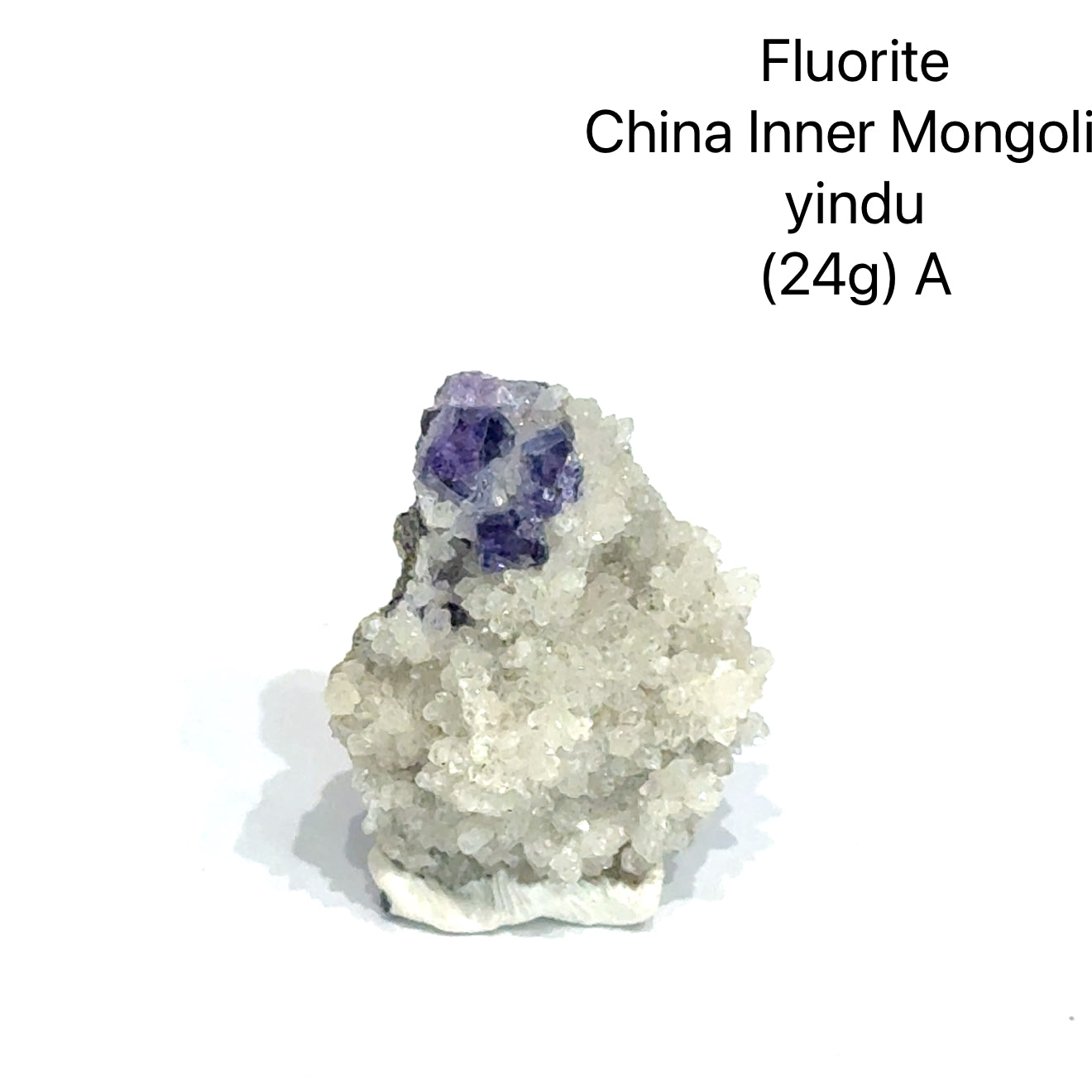 Fluorite crystal from China, Inner Mongolia, with weight and origin information on a white background, (24g) A front view. 
