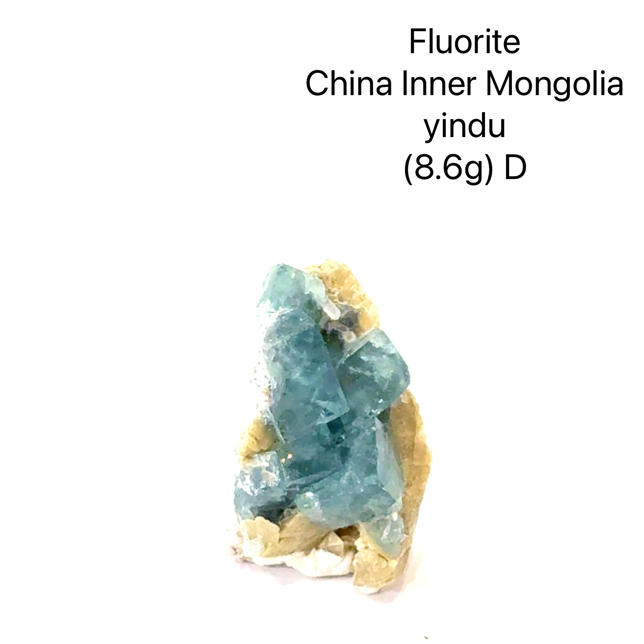 Fluorite crystal from China, Inner Mongolia, with weight and origin information on a white background, (8.6g) D front view. 