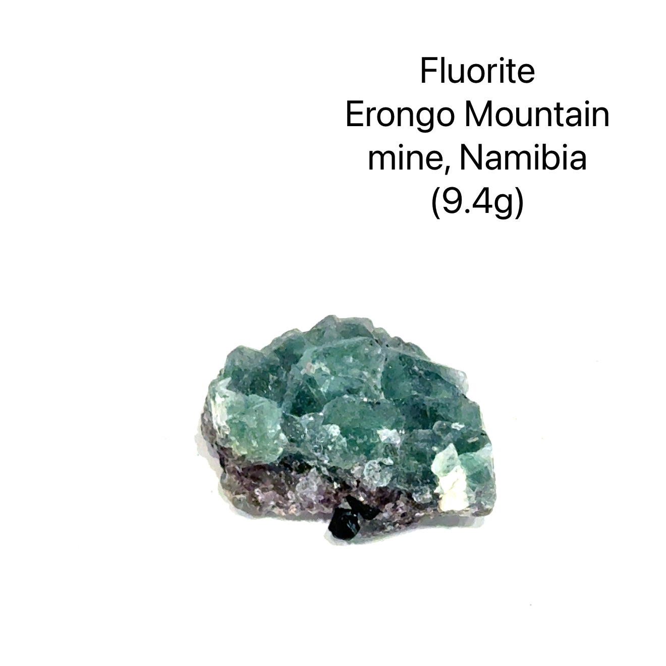 Fluorite crystal from Erongo Mountain mine, Namibia, on a white background (9.4g), front view.