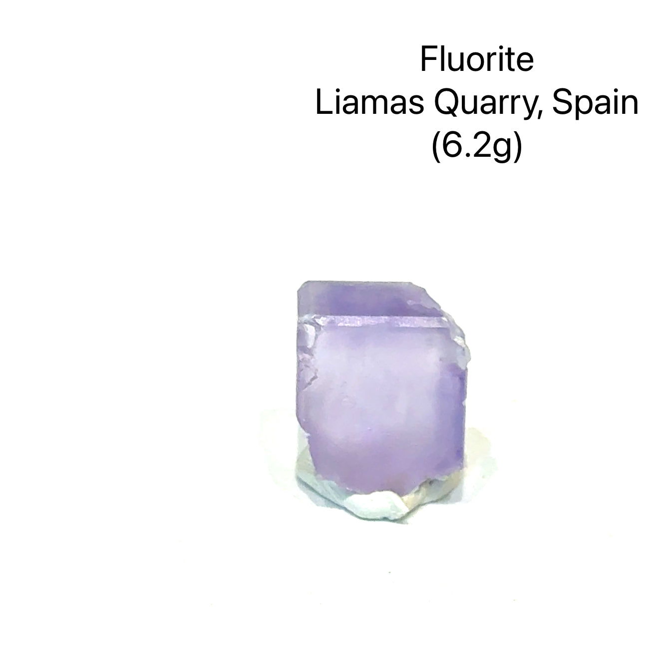 Fluorite crystal from Liamas Quarry, Spain, on a white background (6.2g), front view.