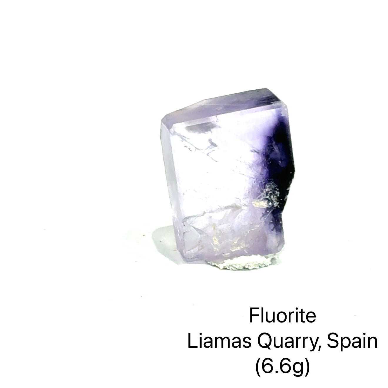 Fluorite crystal from Liamas Quarry, Spain, on a white background (6.6g) B, front view.