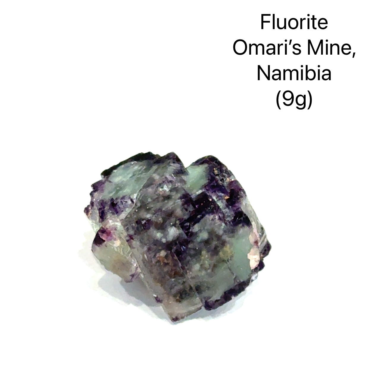 Fluorite crystal from Okorusu Mine, Namibia, on a white background (9g), front view. 